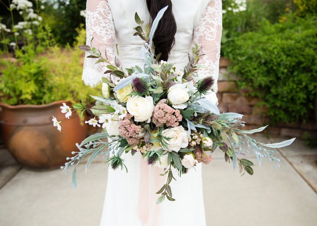 brides flowers behind back