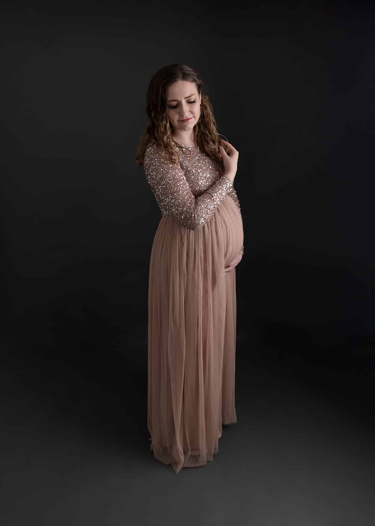 pregnant mom in pink sequin dress