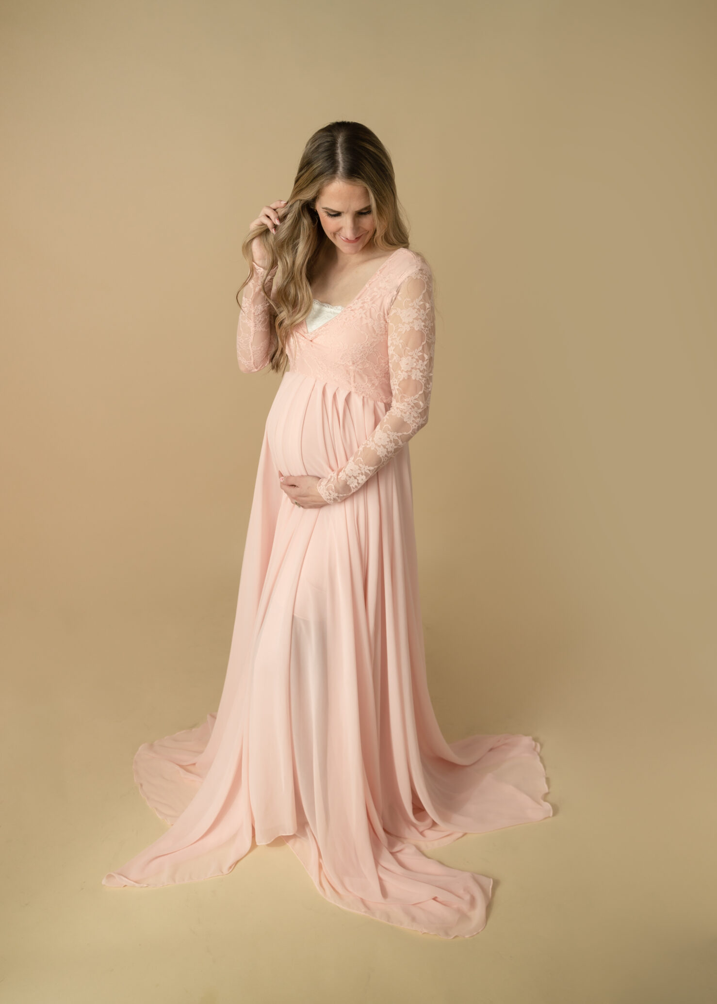 pink lace dress for maternity photo session