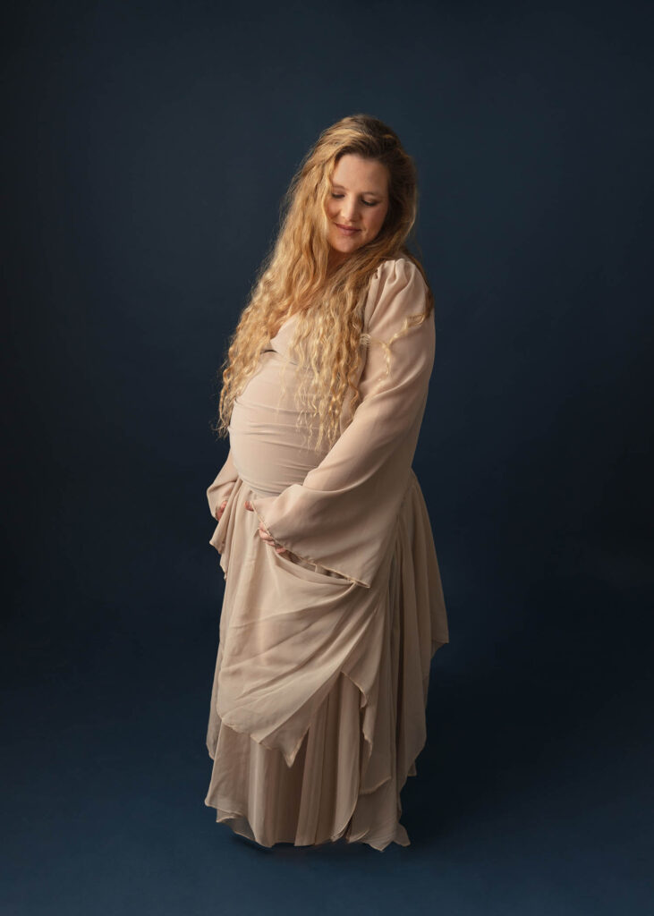 woman in tan maternity gown