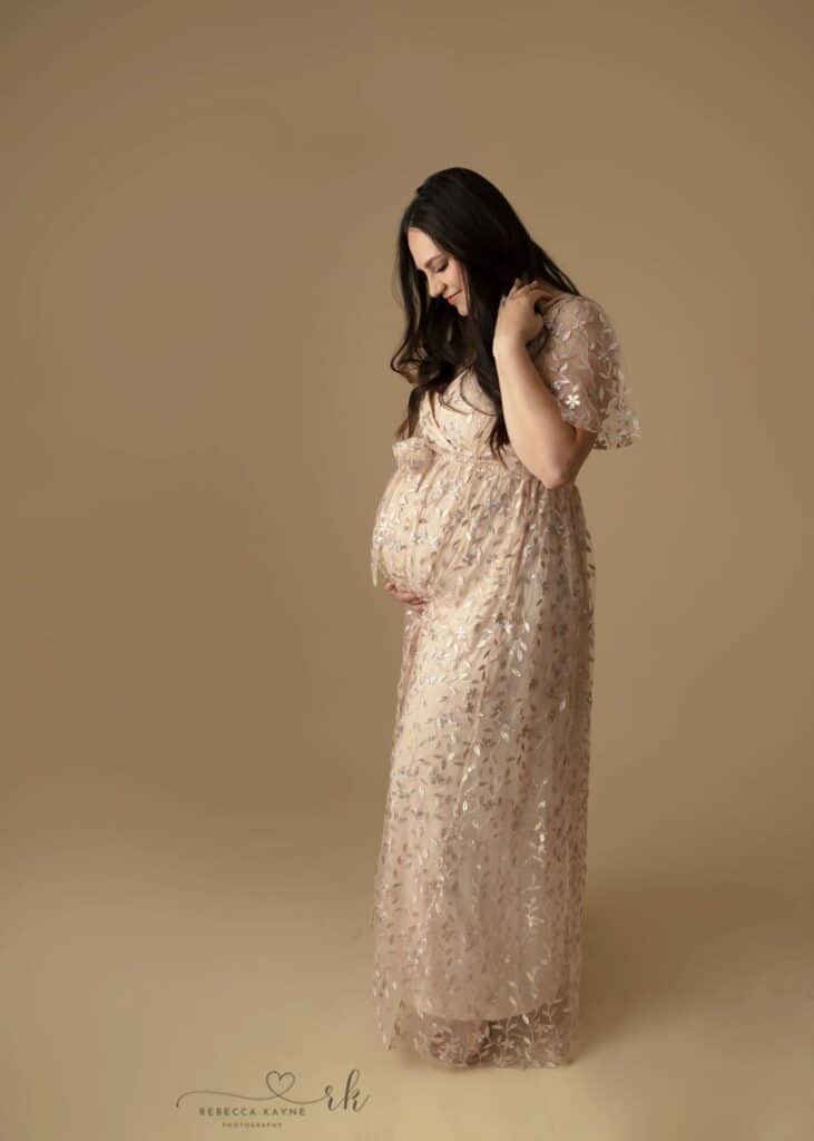 mom in pink sparkly maternity gown