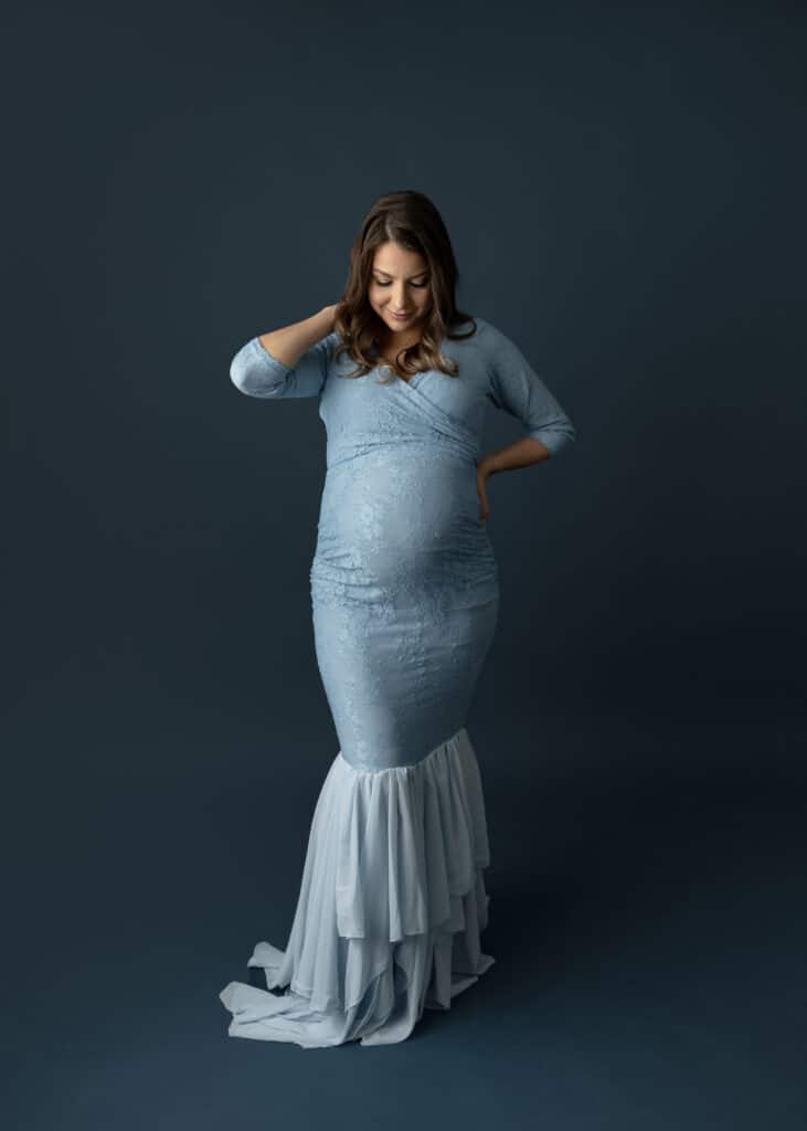 pregnant mom in blue maternity gown mermaid gown