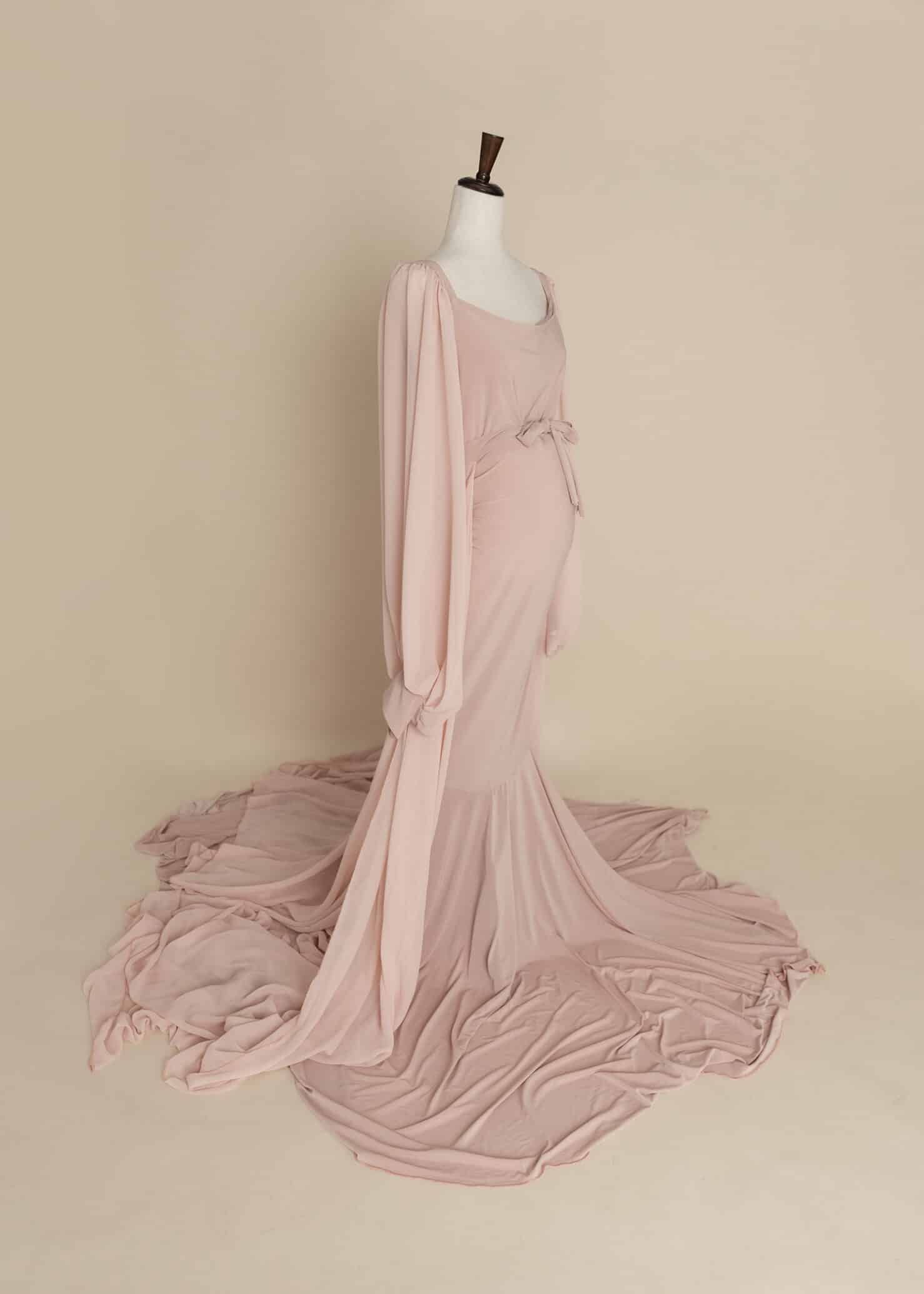 pink maternity dress with sheer sleeves and throwing train