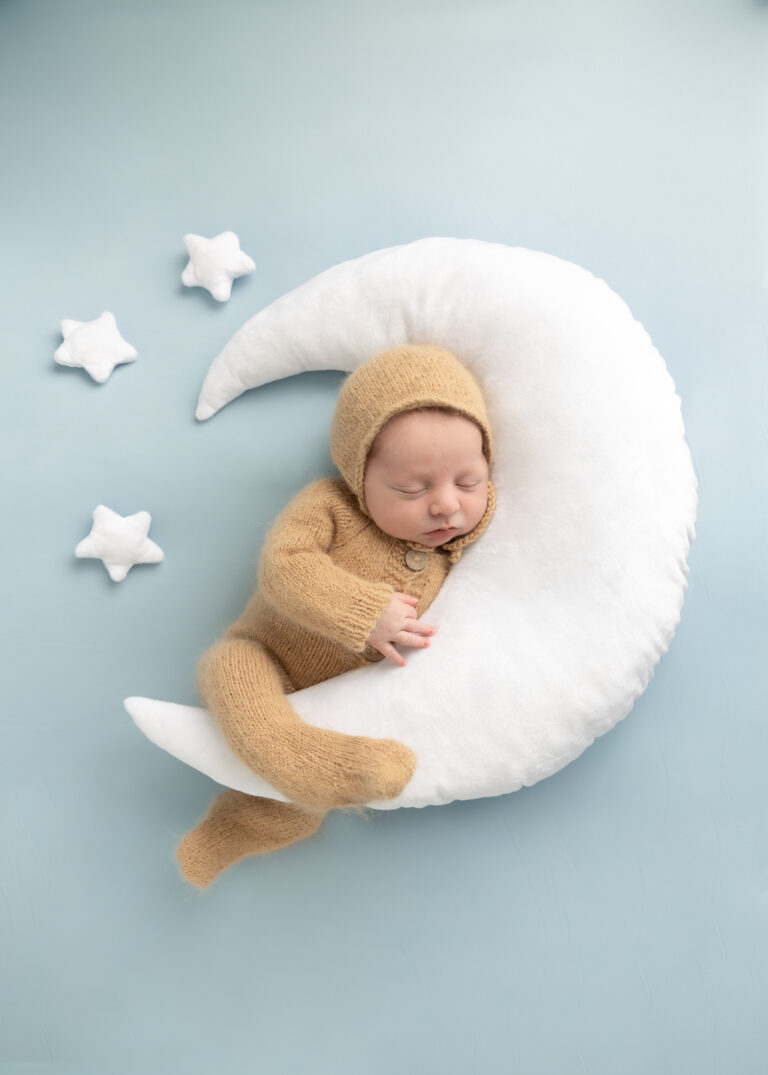 utah county newborn photographer baby portrait with moon and star pillows with brown sleeper