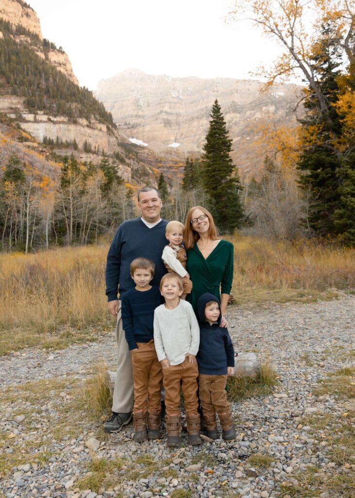 2023 family mini session family in mountains with yellow trees in background