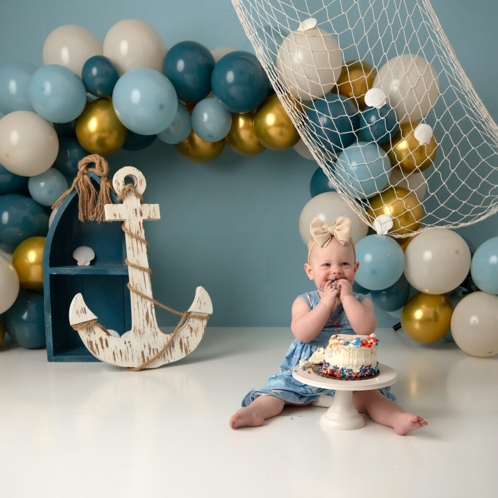 nautical utah county cake smash with boat and anchor and fishing net