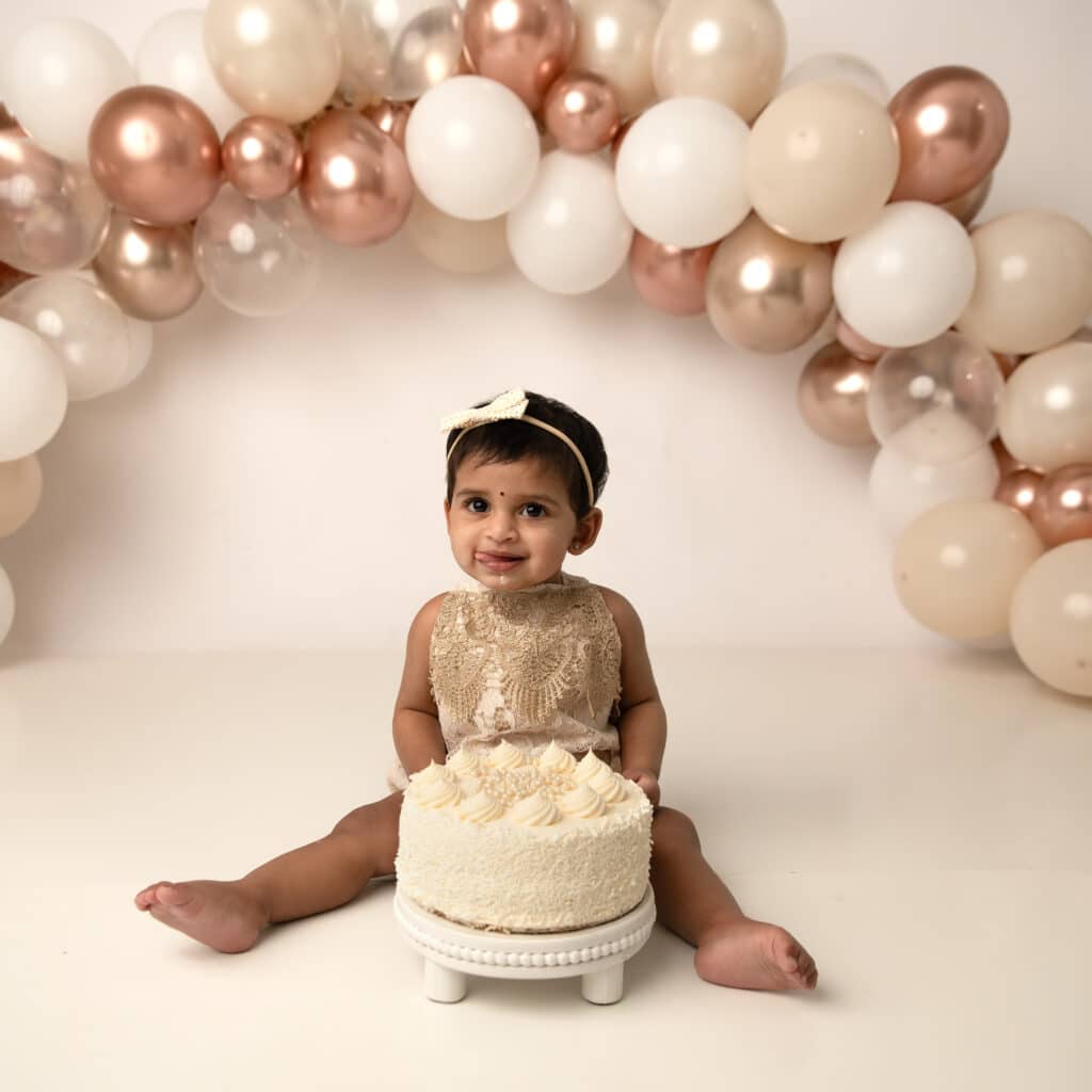 girl cake smash theme gold and tan balloon arch